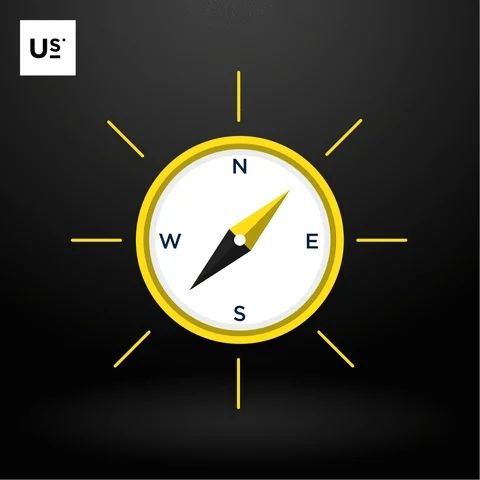 A modern yellow compass with black needle pointing northeast on a dark background.